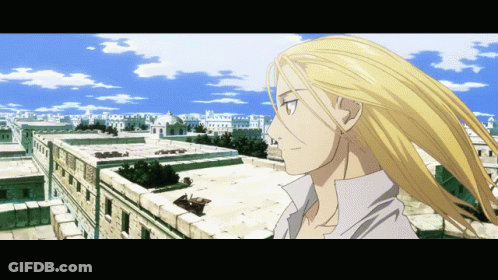 Man With Long Blonde Hair In City GIF