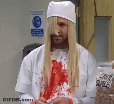 Man With Long Blonde Hair In Front Of Prevent Spread Of Coronavirus Covid 19 Sign GIF