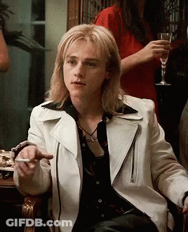 Man With Long Blonde Hair In White Leather Jacket GIF
