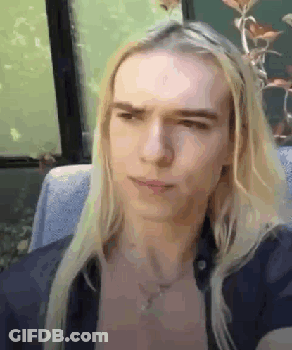 Man With Long Blonde Hair Making Funny Face GIF