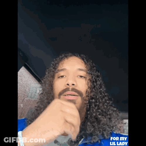 Man With Long Curly Hair And Beard In Blue Jacket Saying For My Lil Lady GIF