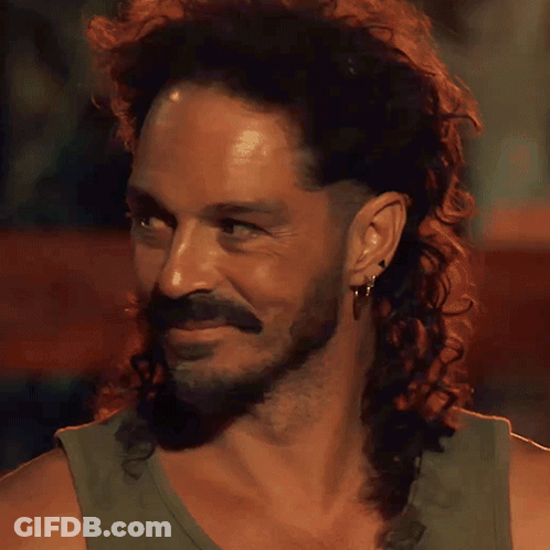 Man With Long Curly Hair And Beard Smiling GIF