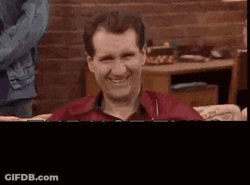 Man With Long Curly Hair And Beard Smiling GIF