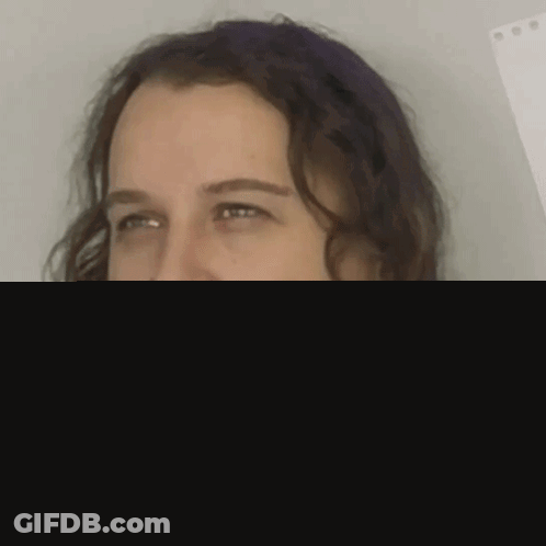 Man With Long Curly Hair And Beard Smiling GIF