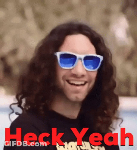 Man With Long Curly Hair And Sunglasses Saying Heck Yeah GIF