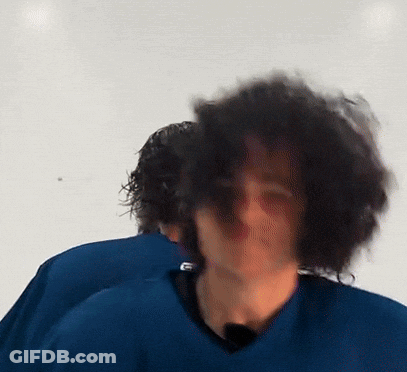 Man With Long Curly Hair In Blue Shirt GIF