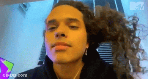 Man With Long Curly Hair Making Funny Face GIF