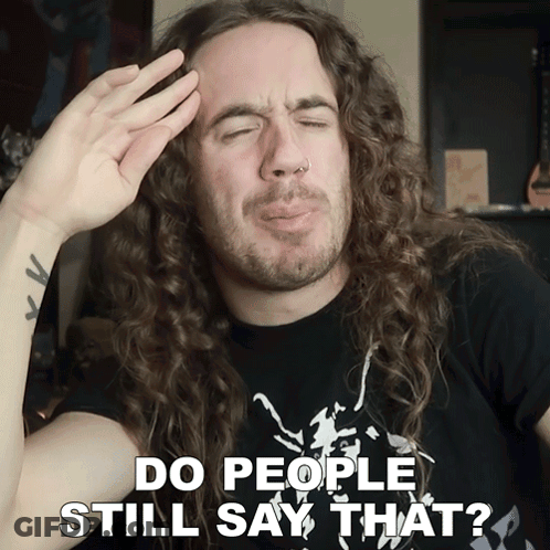 Man With Long Curly Hair Making Funny Face Saying Do People Still Say That GIF