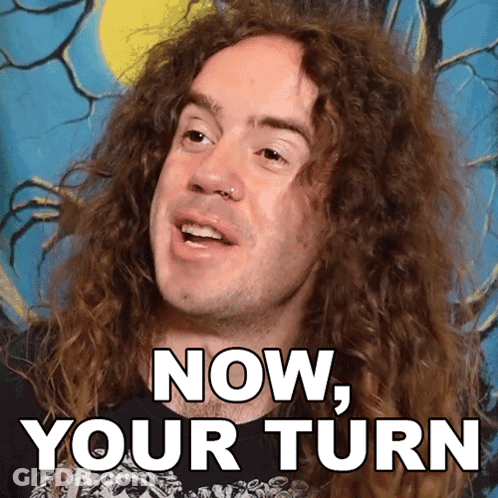 Man With Long Curly Hair Saying Now Your Turn GIF