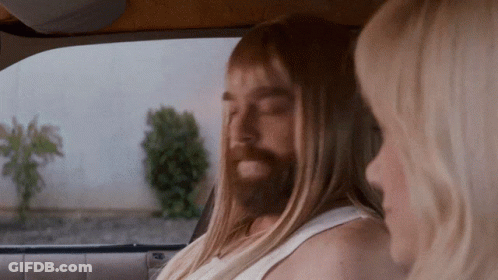 Man With Long Hair And Beard Beside Woman GIF