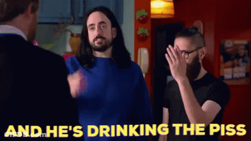 Man With Long Hair And Beard Drinking Piss GIF