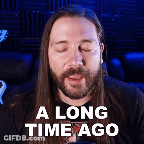 Man With Long Hair And Beard Eyes Closed Saying A Long Time Ago GIF