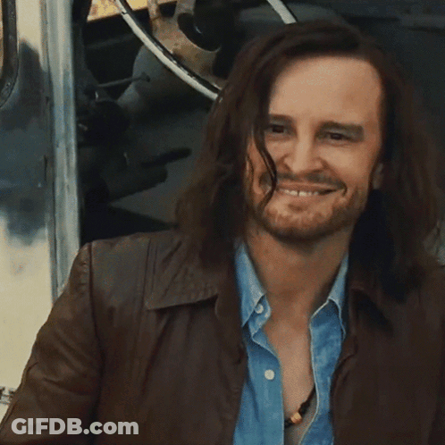Man With Long Hair And Beard Giving Peace Sign GIF