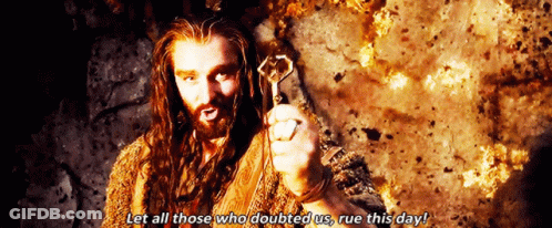 Man With Long Hair And Beard Holding Key Saying Let All Those Who Doubted Us Rue This Day GIF