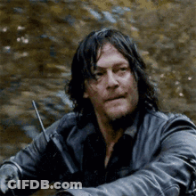 Man With Long Hair And Beard Holding Walkie Talkie GIF