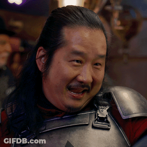 Man With Long Hair And Beard In Armor GIF