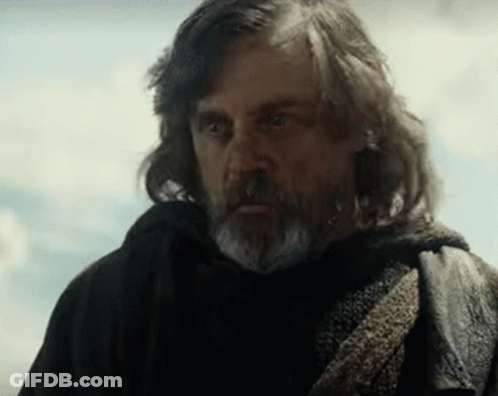 Man With Long Hair And Beard In Black Coat And Scarf GIF