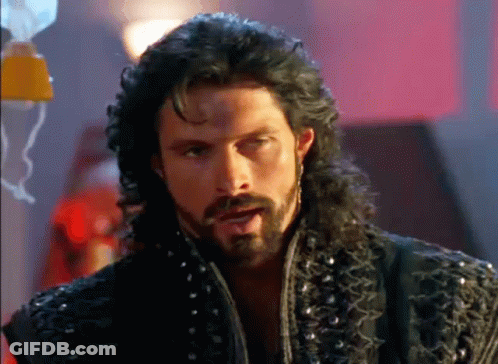 Man With Long Hair And Beard In Black Jacket With Studs GIF