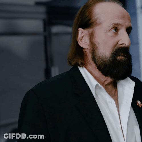 Man With Long Hair And Beard In Black Suit GIF