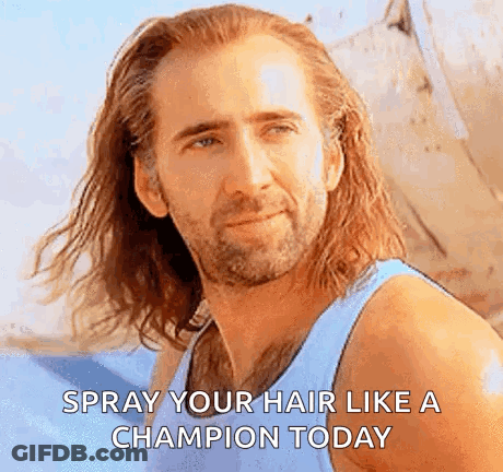 Man With Long Hair And Beard In Blue Tank Top Says Spray Your Hair Like A Champion GIF