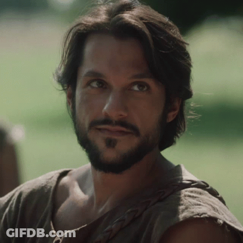 Man With Long Hair And Beard In Brown Shirt GIF