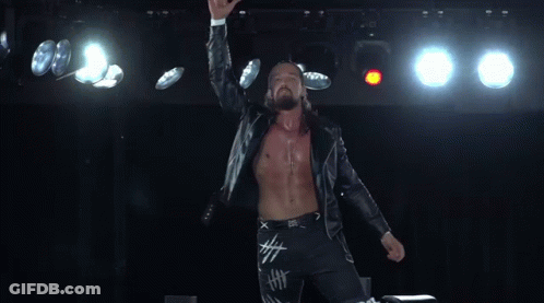 Man With Long Hair And Beard In Cross Jacket GIF