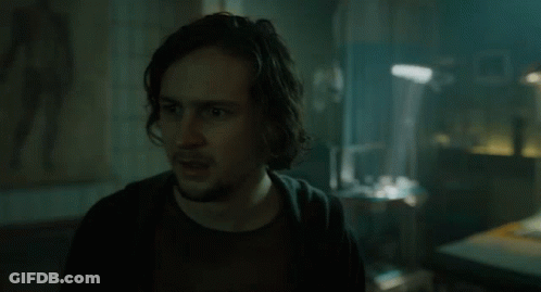 Man With Long Hair And Beard In Dark Room GIF