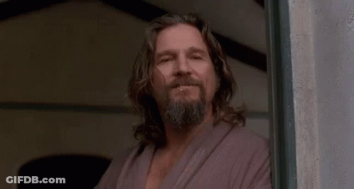 Man With Long Hair And Beard In Front Of Far Out Sign GIF