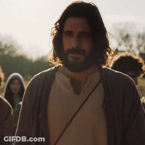 Man With Long Hair And Beard In Front Of Group GIF