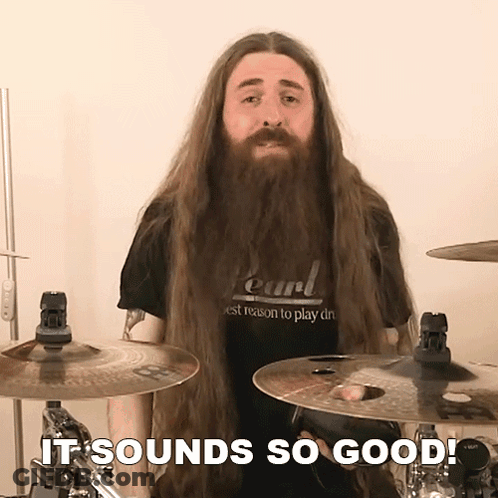 Man With Long Hair And Beard In Pearl Shirt Playing Drums GIF