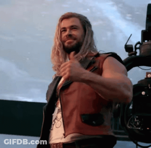 Man With Long Hair And Beard In Red Leather Vest GIF