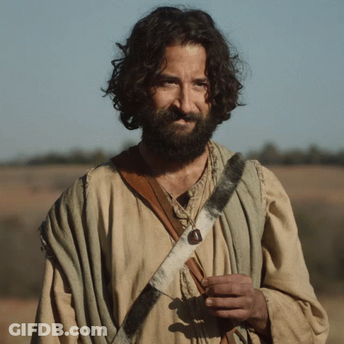 Man With Long Hair And Beard In Sheepskin Strap GIF