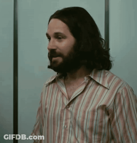 Man With Long Hair And Beard In Striped Shirt GIF