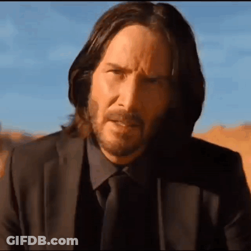 Man With Long Hair And Beard In Suit GIF