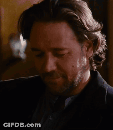 Man With Long Hair And Beard Looking Down GIF