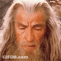 Man With Long Hair And Beard Looking Down GIF