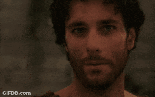 Man With Long Hair And Beard Looks Angry GIF