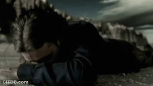 Man With Long Hair And Beard Lying Down GIF