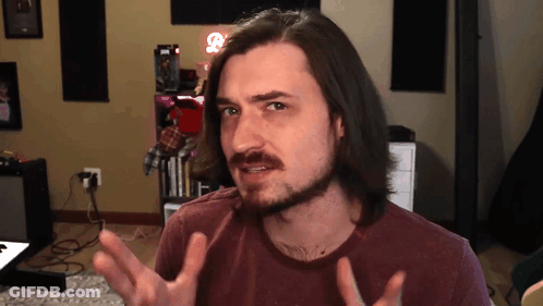 Man With Long Hair And Beard Making Face GIF
