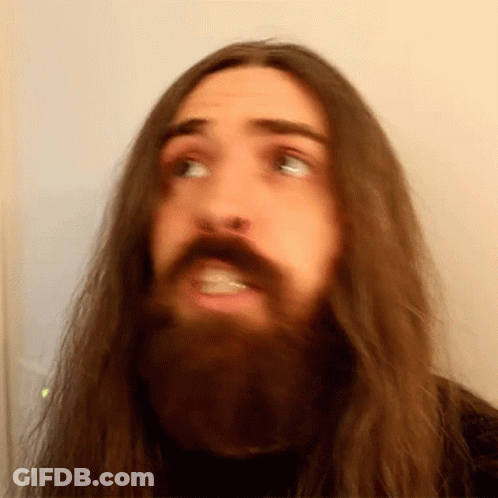 Man With Long Hair And Beard Making Face GIF