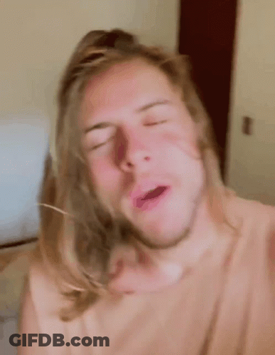 Man With Long Hair And Beard Making Funny Face GIF
