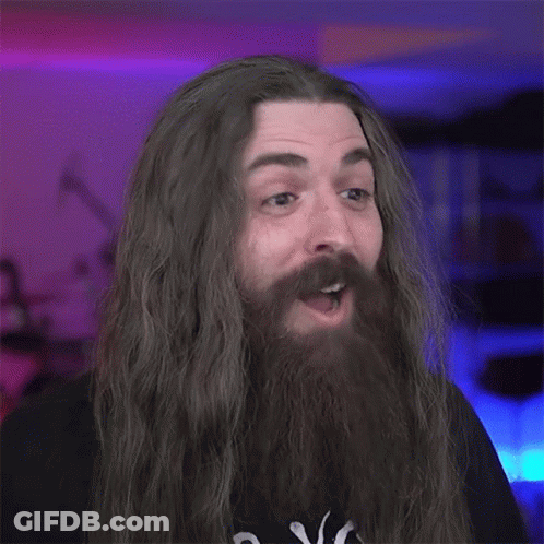 Man With Long Hair And Beard Making Funny Face GIF