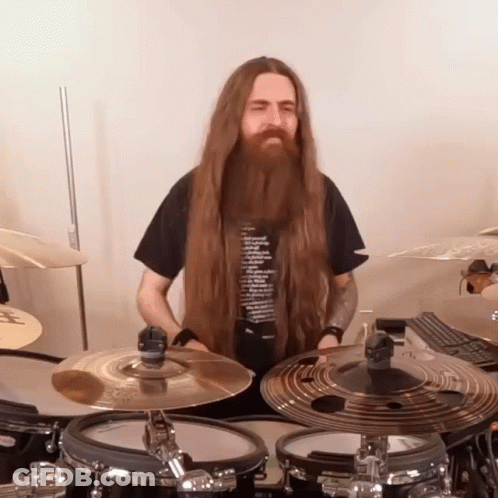 Man With Long Hair And Beard Playing Drums GIF
