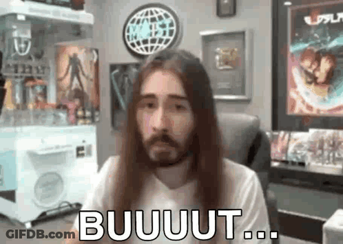 Man With Long Hair And Beard Sitting By Popcorn Machine GIF