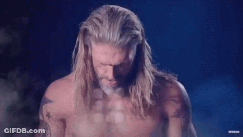 Man With Long Hair And Beard Standing Before DC GIF