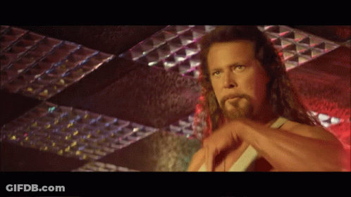 Man With Long Hair And Beard Standing In Front Of Ceiling GIF