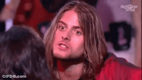Man With Long Hair And Beard Standing Next To Woman GIF