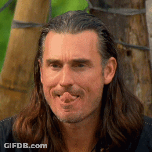 Man With Long Hair And Beard Sticking Out Tongue GIF