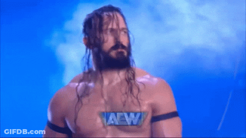 Man With Long Hair And Beard Wearing AEW Shirt GIF