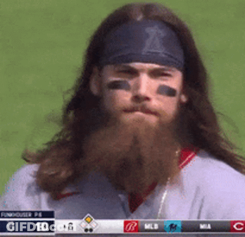 Man With Long Hair And Beard Wearing Headband With Letter T GIF
